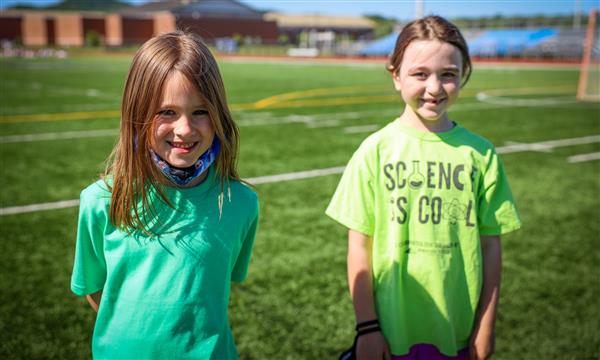 Two girls smile